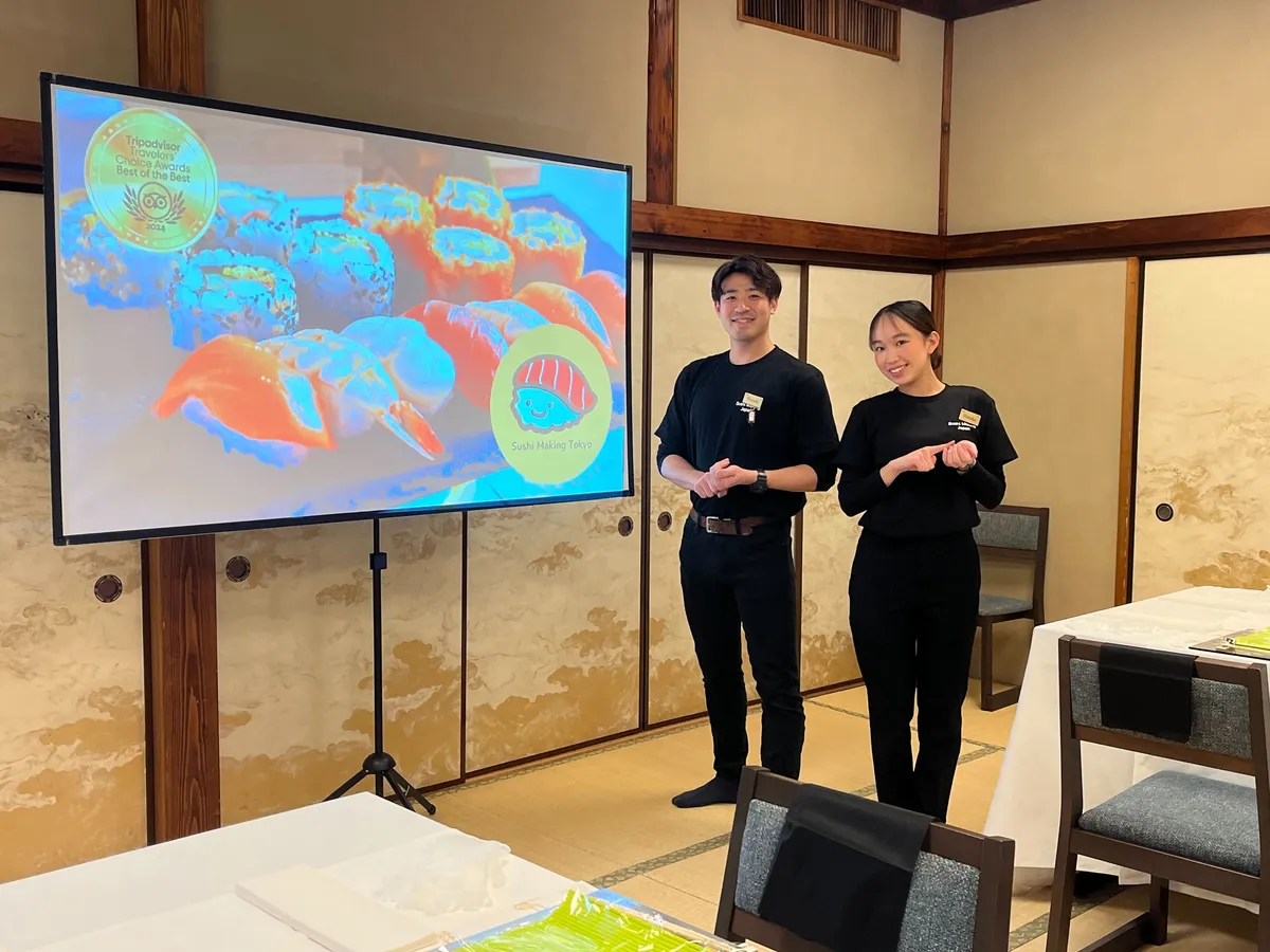 Instructors presenting at a tatami hall offsite venue